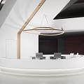 Modern Circular White Reception Desk With Ambient Lighting And Nearby Staircase