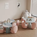 Cute Pink And Blue Children's Chairs With Small Tables In Indoor Kids Room