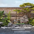 Tropical Courtyard Garden With Wooden Wall Lush Green Plants Fountain Rocks And Stone Path