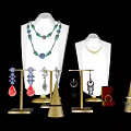 Fashionable Jewelry Collection With Necklaces Earrings Ring On Mannequins And Stands