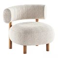 Light Beige Upholstered Leisure Chair With Curved Backrest Wooden Legs And Brown Knitted Blanket