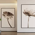 Black And White Flower Botanical Prints Hanging On Wall With Green Plants