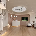 Modern Yoga Studio Reception Area with White Sofa Wooden Flooring Pendant Lights TV Clothing Rack