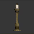 Elegant Golden Candlestick With Lit Candle And Slender Decorative Design