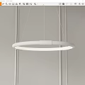 Modern White Circular Chandelier Hanging in Minimalist Interior with White Ceiling and Thin Cords