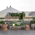 Woven Rattan Outdoor Chairs With Cozy Patio Umbrella Plants And Side Tables