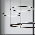 Sleek Modern Black Circular Ring Chandelier Hanging Against White Background