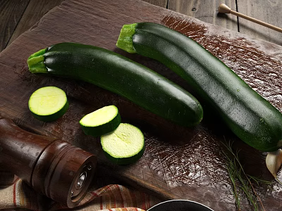 Fresh Zucchini Vegetables Whole And Sliced On Wooden Cutting Board With Pepper Grinder And Herbs 3d model