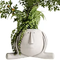 Decorative Bonsai Plant With Lemon Fruits In Face Shaped Pot And Green Foliage