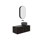 Modern Bowl Washbasin Design With Oval Dark Wooden Countertop And Black Faucet On Light Wall