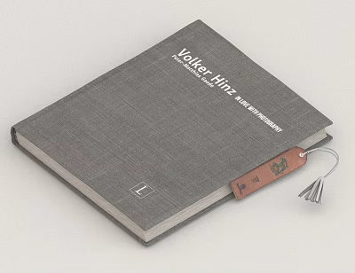 Volker Hitzig Book With Gray Textured Cover And Leather Tag Design 3d model