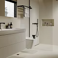 Minimalist Modern Bathroom Interior With White Vanity Wall Mounted Shelf Toiletries Beige Walls And Black Accents