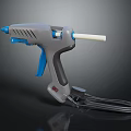 Gray Glue Gun With Blue Handle White Glue Stick And Black Power Cord
