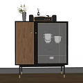 Modern Wooden Sideboard With Black Frame Glass Doors And Decorative Items On Top