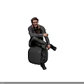 A Man Sitting On Gray Cube Wearing Gray Cardigan And Dark Pants With Beard