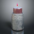 Candle Lamp With Textured Silver Container And Lit Red Candle For Modern Home Decor