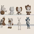 Plush Dolls With Various Animal Designs Displayed On White Shelves