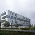 Modern Office Building Exterior With Lush Greenery And Water Feature