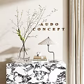 Decorative Ornament Combination With Glass Vase Twigs Table Lamp Books On Marble Table