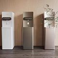 Modern Home Water Dispensers in Three Colors with Sleek Design and Green Plant