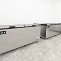 Three Stainless Steel Chest Freezers in White Room with Marble Floor and Open Lid