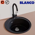 Sleek Black Round Wash Basin With Black Curved Faucet On Light Colored Countertop