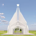 White Arched Spire Building With Star On Top In Green Grassland And Blue Sky
