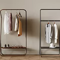 Modern Metal Clothes Rack With Hanging Shirts Dresses And Shoes On Lower Shelf