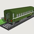 Single Green Train Carriage Parked On Railway Tracks With Green Grass Nearby
