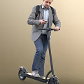 Man In Gray Blazer And Jeans Riding Electric Scooter Using Smartphone