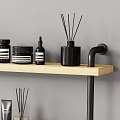 Stylish Modern Bathroom Accessories On Wooden Shelf With Bottles Jars Candles Toilet Paper And Boxes