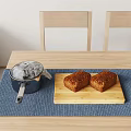 Stainless Steel Pot And Wooden Cutting Board With Fresh Baked Bread
