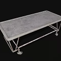 Sturdy Metal Medical Cart With Four Wheels And Flat Surface For Hospital Use