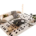 Beige Curved Sofa with Green Cushions and Black Round Coffee Table Set on Spotted Rug