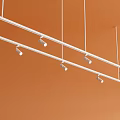 Track Mounted Downlights and Spotlights on Orange Ceiling with Multiple Fixtures