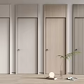 Four Different Colored Flush Doors with Light Walls Light Wood Flooring Green Plant and Decor