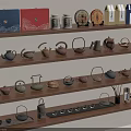 Traditional Tea Set Display With Various Teapots Cups And Colorful Packages On Wooden Shelves
