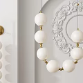 Modern White Globe Chandelier With Gold Accents And Carved Wall Decor Design
