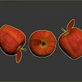 Three Fresh Red Apples on Shiny Reflective Surface with Green Leaf