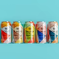 Colorful Canned Drinks with Various Flavors Including Tropical Passion Fruit Lime and Fig