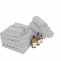 Soft Rolled And Stacked Towels With Gentle Cleanser Bottles For Daily Laundry Use
