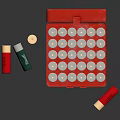 Open Red Metal Box Full of Firearm Bullets with Loose Cartridges Beside