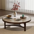 Modern Round Glass Top Wooden Coffee Table With Elegant Decorations In Cozy Living Room