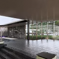 Contemporary Commercial Street Landscape With Glass Facade Reflecting Pool And Cherry Blossom Tree