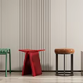 Modern Stools in Various Colors and Designs Against Striped Wall and Wooden Floor