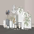 Floral Installation with White Bust Statue Geometric Pedestals Pink White Flowers Candles and Scattered Petals