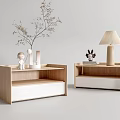 Modern Wooden Bedside Tables With White Bases And Decorative Items Like Lamp Books And Figurines