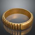 Golden Ring Shaped Daily Use Item With Textured Surface And Polished Finish