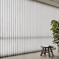 White Vertical Blinds in Interior Room with Green Plant and Small Wooden Stool