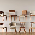 Eight Dining Chairs With Various Designs Against Light Colored Walls And Wooden Floor
